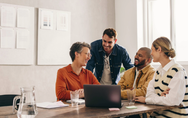 Four people meeting in a conference room